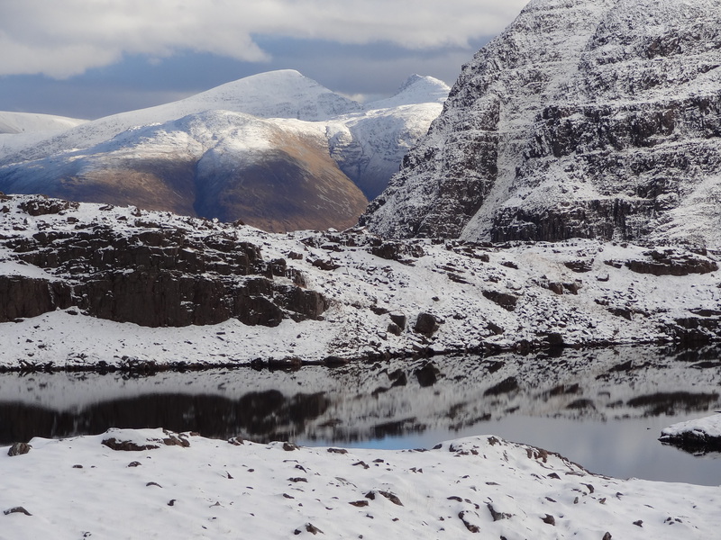 Sgurr Choinnich and Sgurr a'Chaorachain beyond the cliffs of Fuar Tholl from Sgorr Ruadh